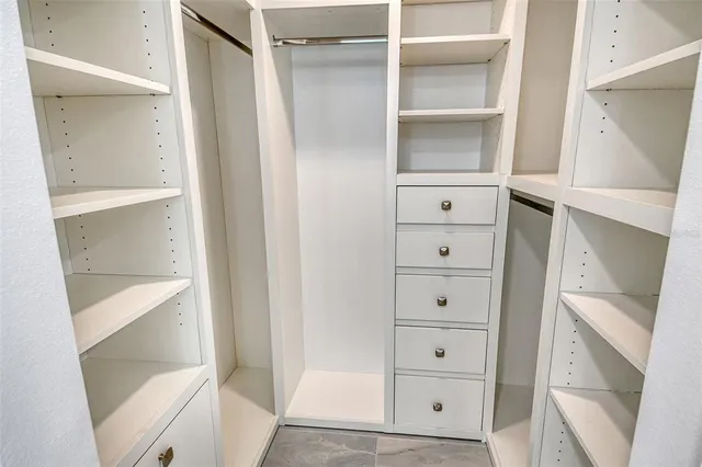 a view of an empty walk in closet