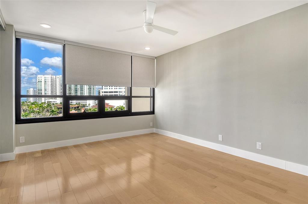 1255 North Gulfstream Avenue, Unit 702 Sarasota, FL 34236 - Photo 34 of 53 an empty room with windows