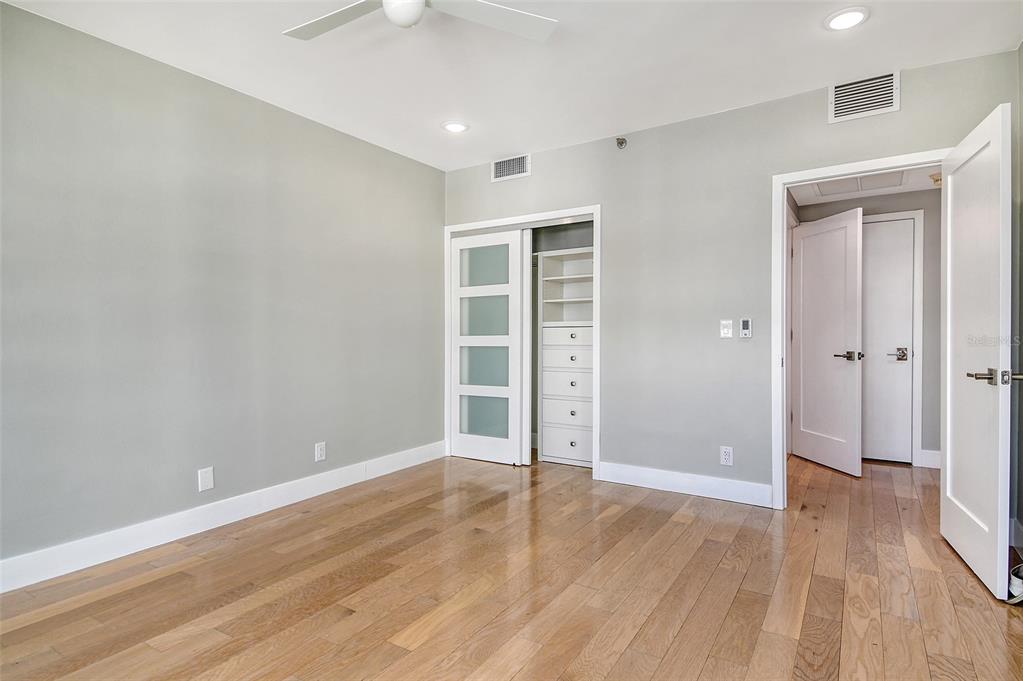 1255 North Gulfstream Avenue, Unit 702 Sarasota, FL 34236 - Photo 36 of 53 wooden floor in an empty room with a window