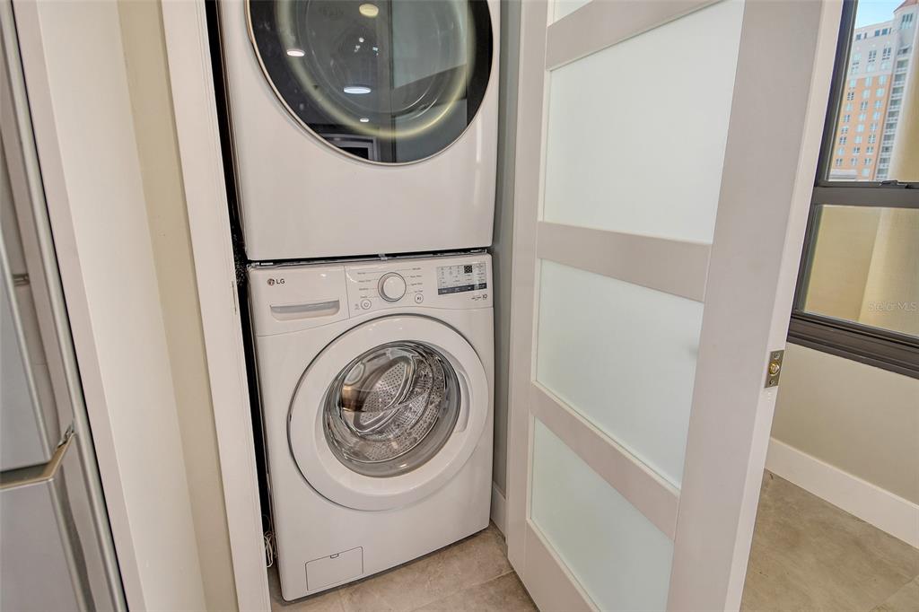 1255 North Gulfstream Avenue, Unit 702 Sarasota, FL 34236 - Photo 38 of 53 a utility room with dryer and washer