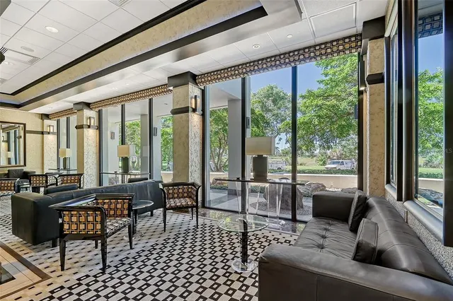 a outdoor space with a large window and furniture