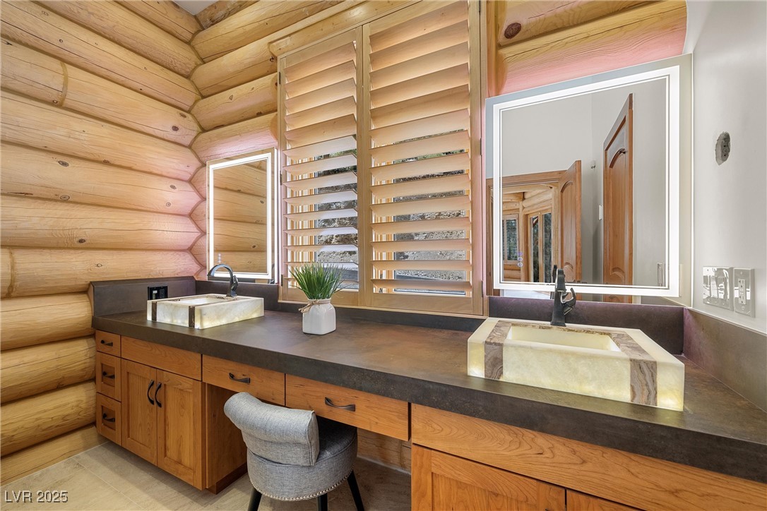 4927 Snow White Road Mount Charleston, NV 89124 - Photo 17 of 65 Full bathroom with double vanity, onyx light up sinks and mirrors