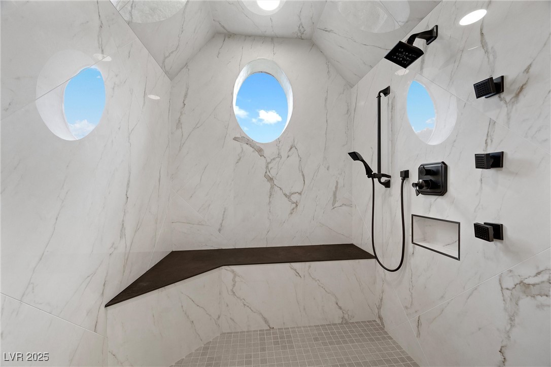 4927 Snow White Road Mount Charleston, NV 89124 - Photo 28 of 65 Steam shower stall featuring a marble finish shower, oval window, mountain views