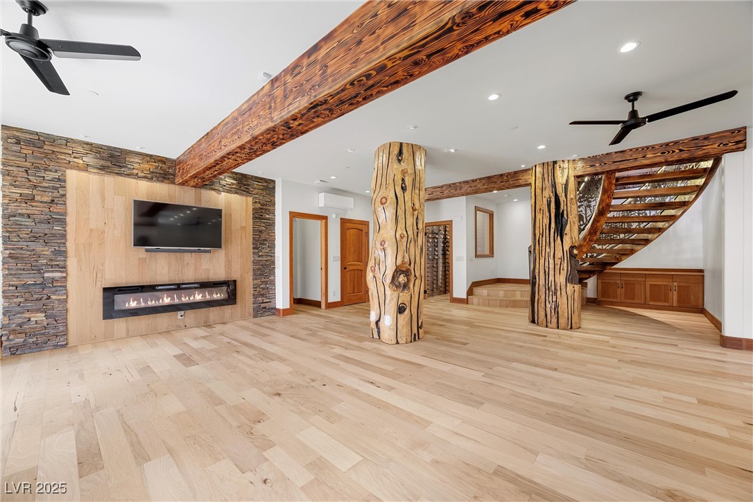 4927 Snow White Road Mount Charleston, NV 89124 - Photo 37 of 65 Electric fireplace, 32" custom accent logs, Cherrywood cabinetry, wine room