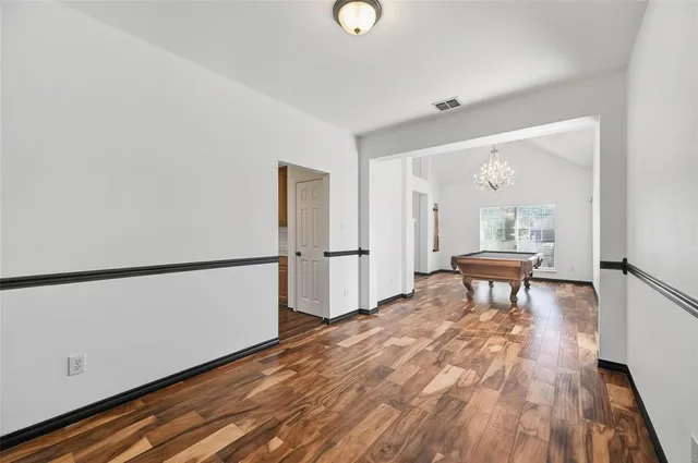 a view of a livingroom with furniture and wooden floor