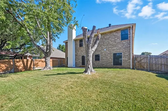 a house with a tree in front of it