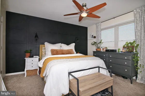 a bedroom with a bed and a closet