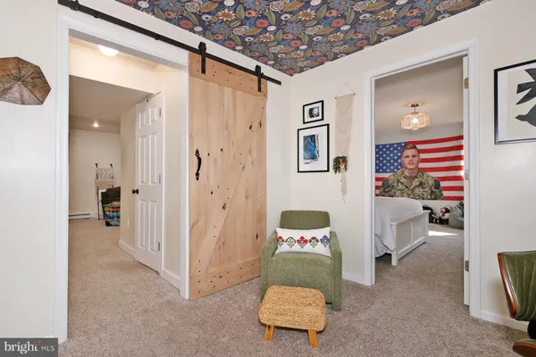a living room with furniture and a area