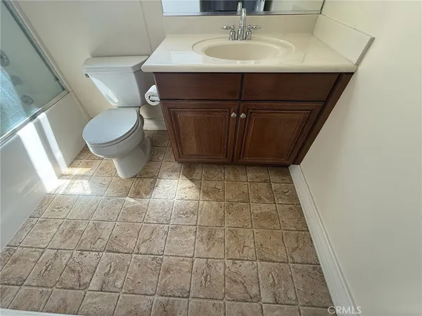 a bathroom with a sink and toilet