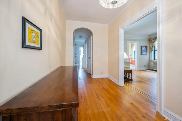 wooden floor in a hall with an entryway