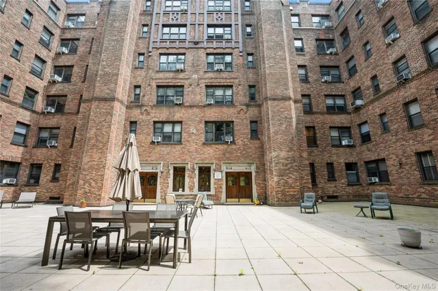 a view of a building with sitting area
