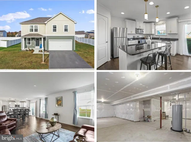a view of kitchen with kitchen island and stainless steel appliances