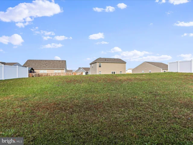a view of a big room with table and chairs