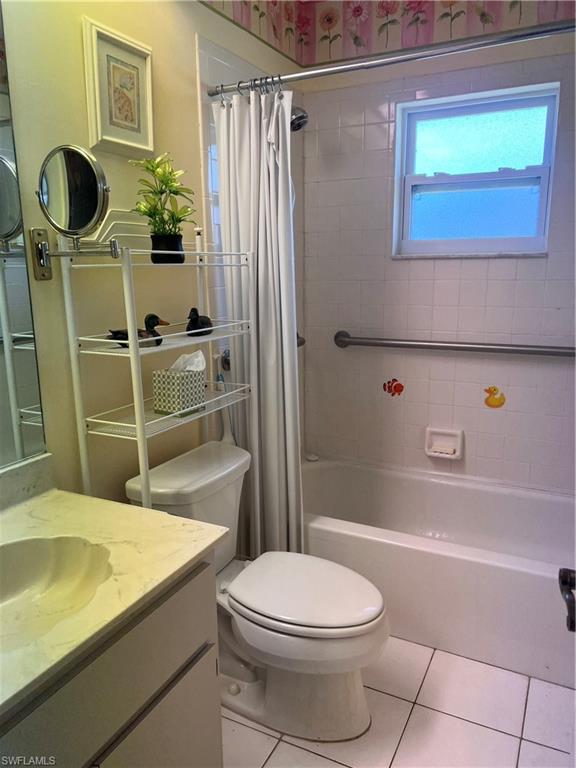 140 Bordeaux Circle Naples, FL 34112 - Photo 16 of 22 a bathroom with a sink a toilet and shower