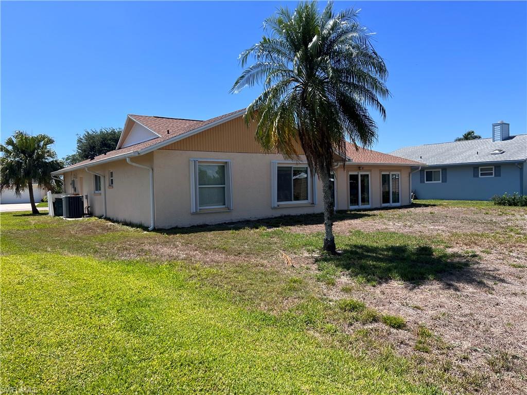 140 Bordeaux Circle Naples, FL 34112 - Photo 2 of 22 a house with palm tree in front of it