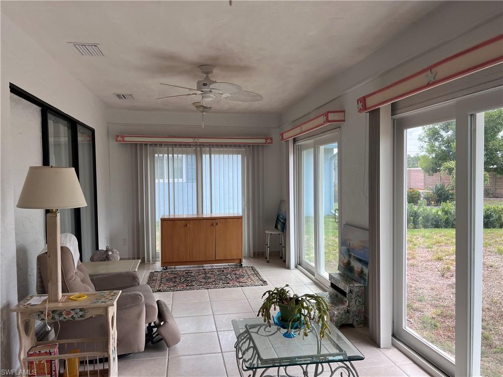 140 Bordeaux Circle Naples, FL 34112 - Photo 21 of 22 a living room with furniture and a window