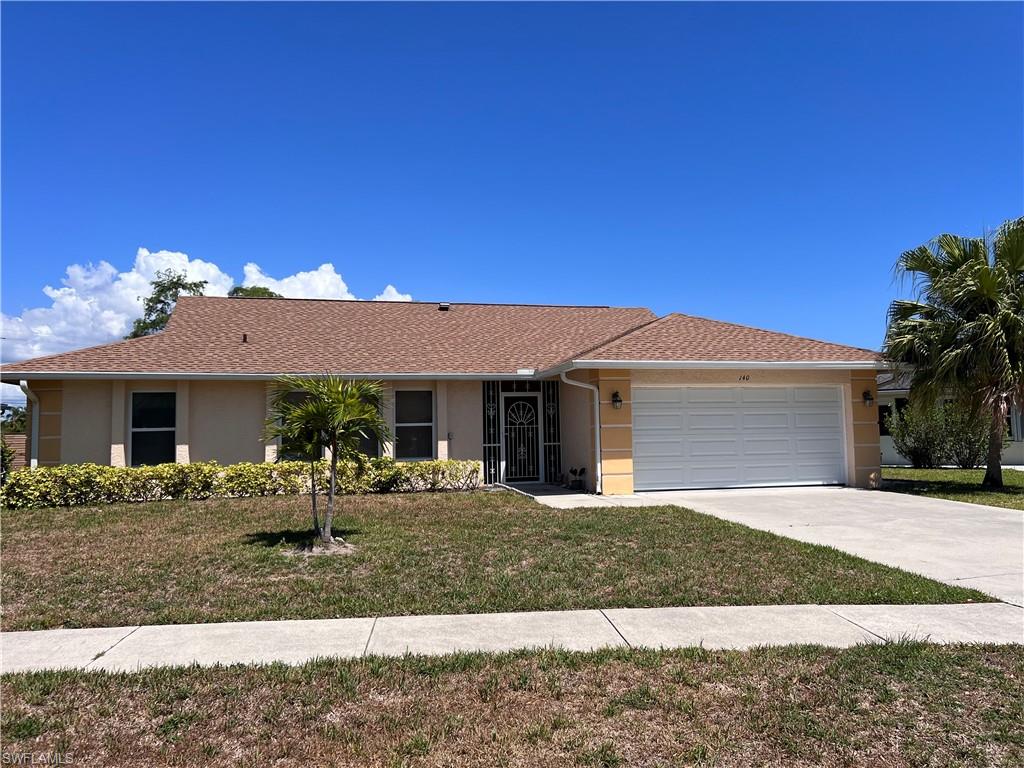 140 Bordeaux Circle Naples, FL 34112 - Photo 5 of 22 front view of a house with a porch