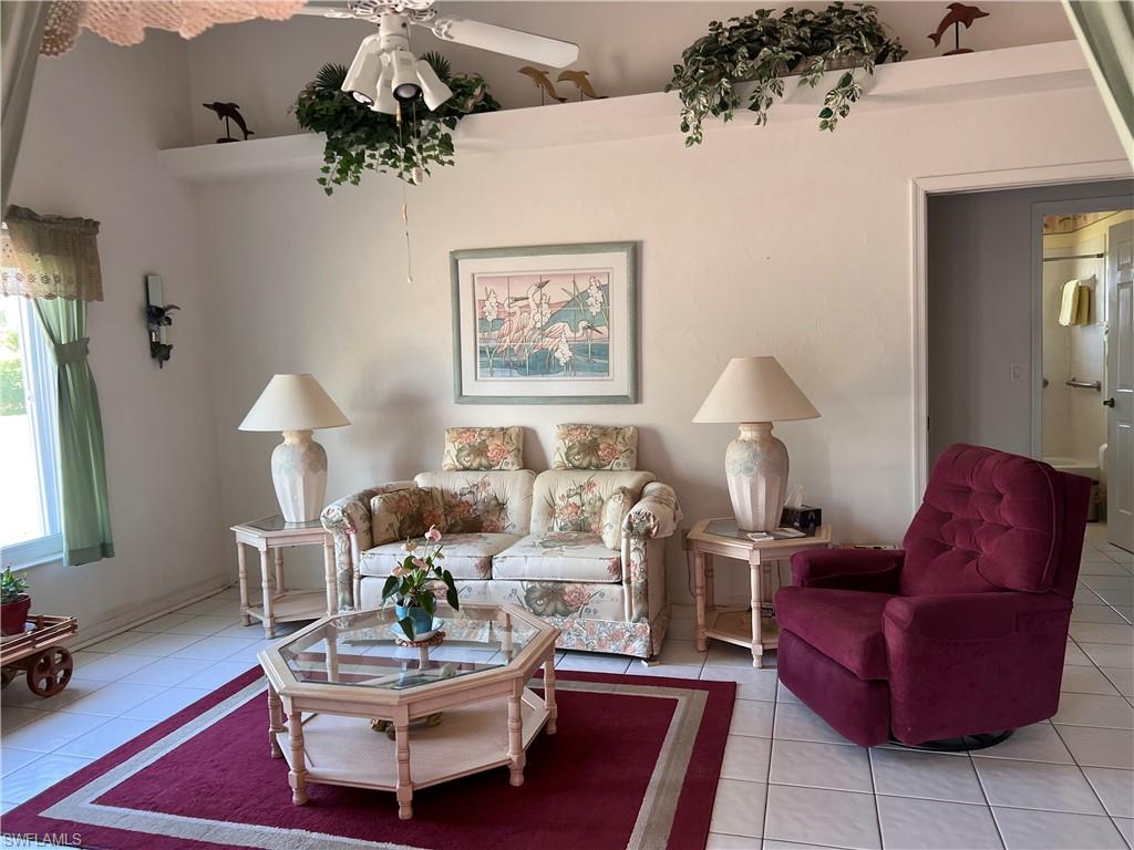 140 Bordeaux Circle Naples, FL 34112 - Photo 9 of 22 a living room with furniture and wooden floor