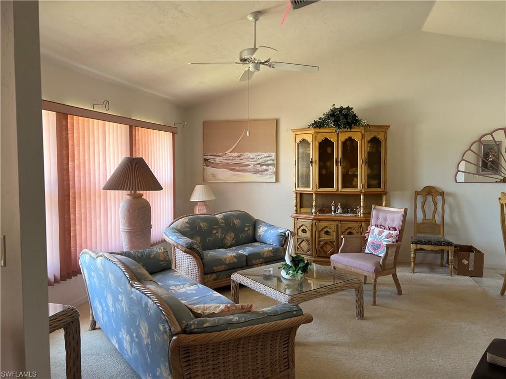 140 Bordeaux Circle Naples, FL 34112 - Photo 10 of 22 a living room with furniture and a window