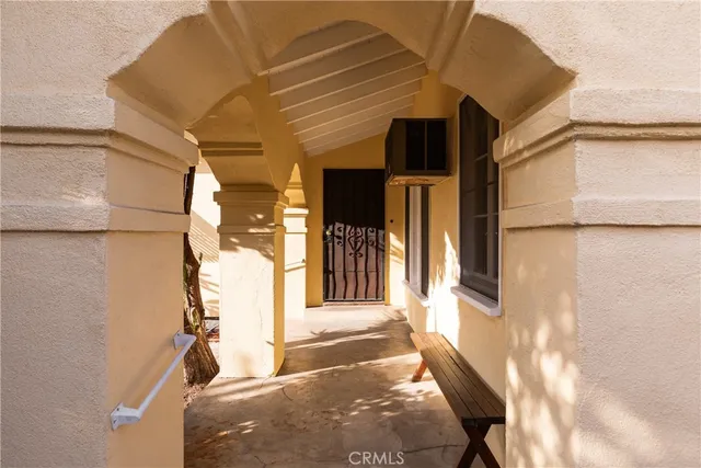 a view of a house with a door and wooden floor