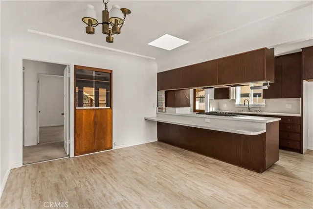 a kitchen with stainless steel appliances granite countertop a sink and stove