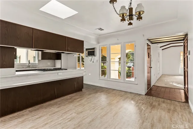 a large kitchen with a large window