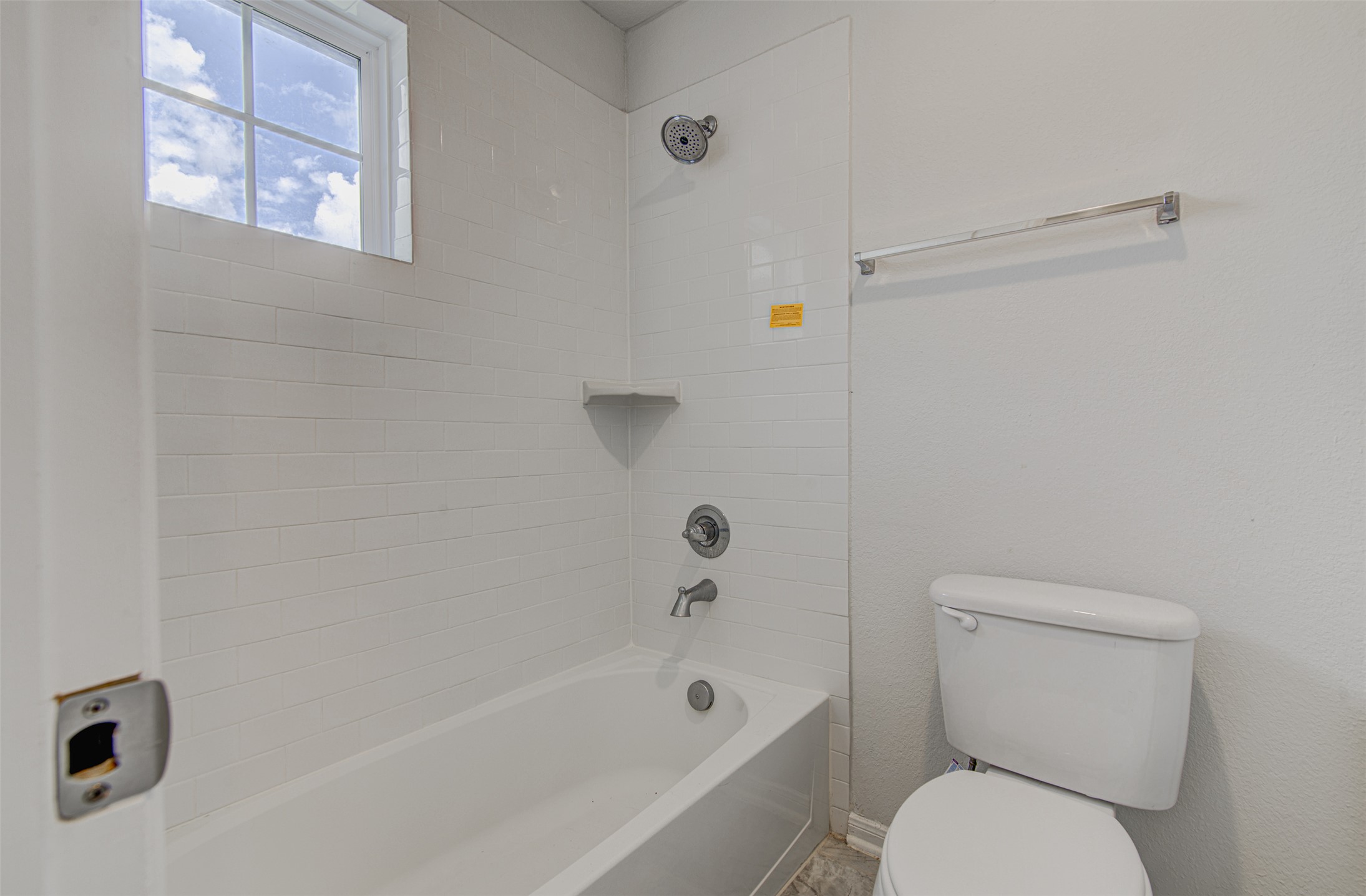 774 Cherrystone Loop Buda, TX 78610 - Photo 25 of 38 A well-appointed bath features a tub with shower and window for natural light.