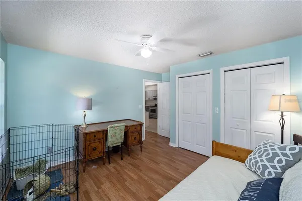 a bedroom with a bed and a table in it