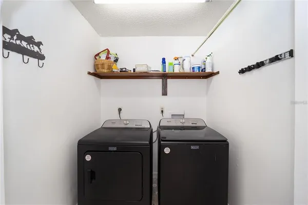 a view of a sink with washer and dryer
