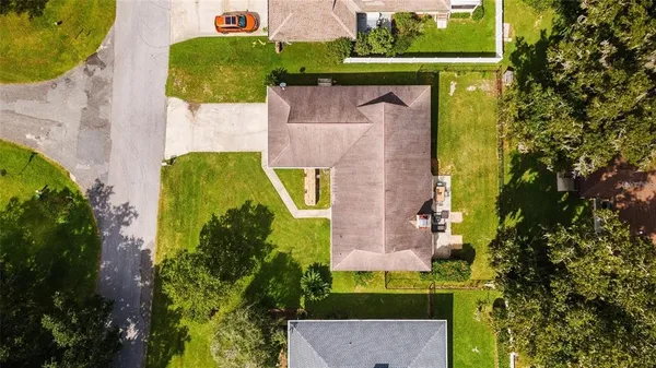 an aerial view of a house with a garden