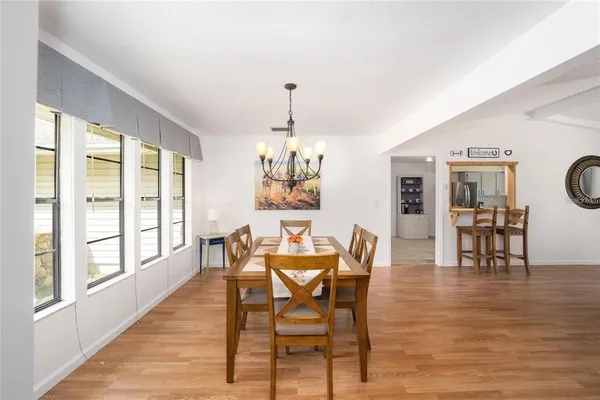 a dining room with furniture window wooden floor