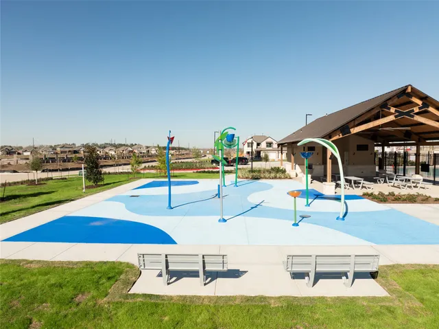 a swimming pool with chairs
