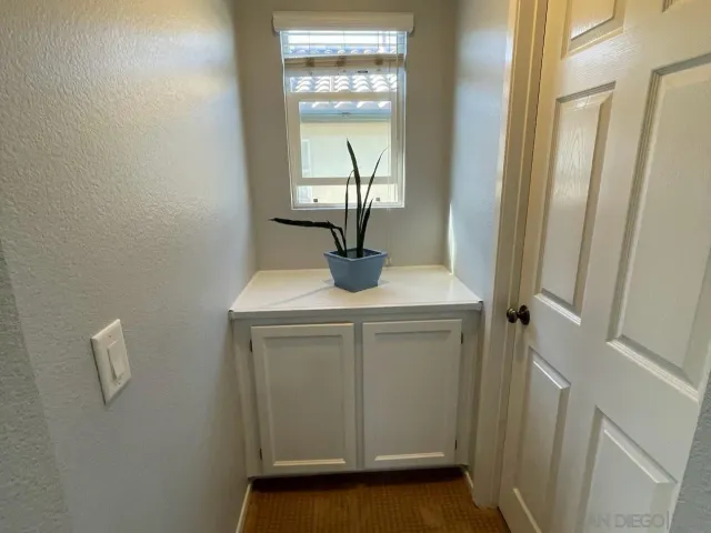 a view of a table and chairs under an umbrella