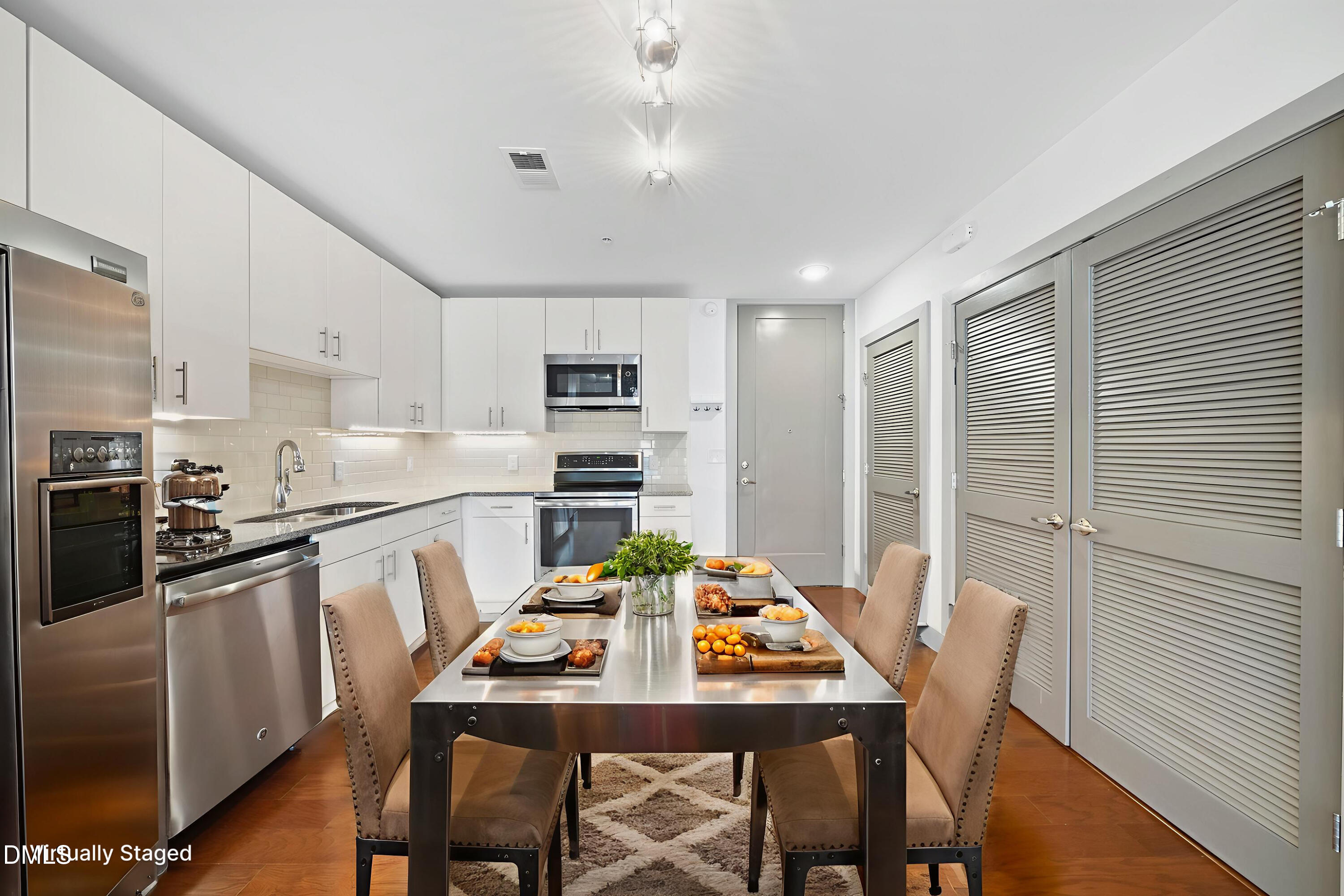 1300 St Marys Street, Unit 207 Raleigh, NC 27605 - Photo 3 of 18 a view of a dining room with furniture