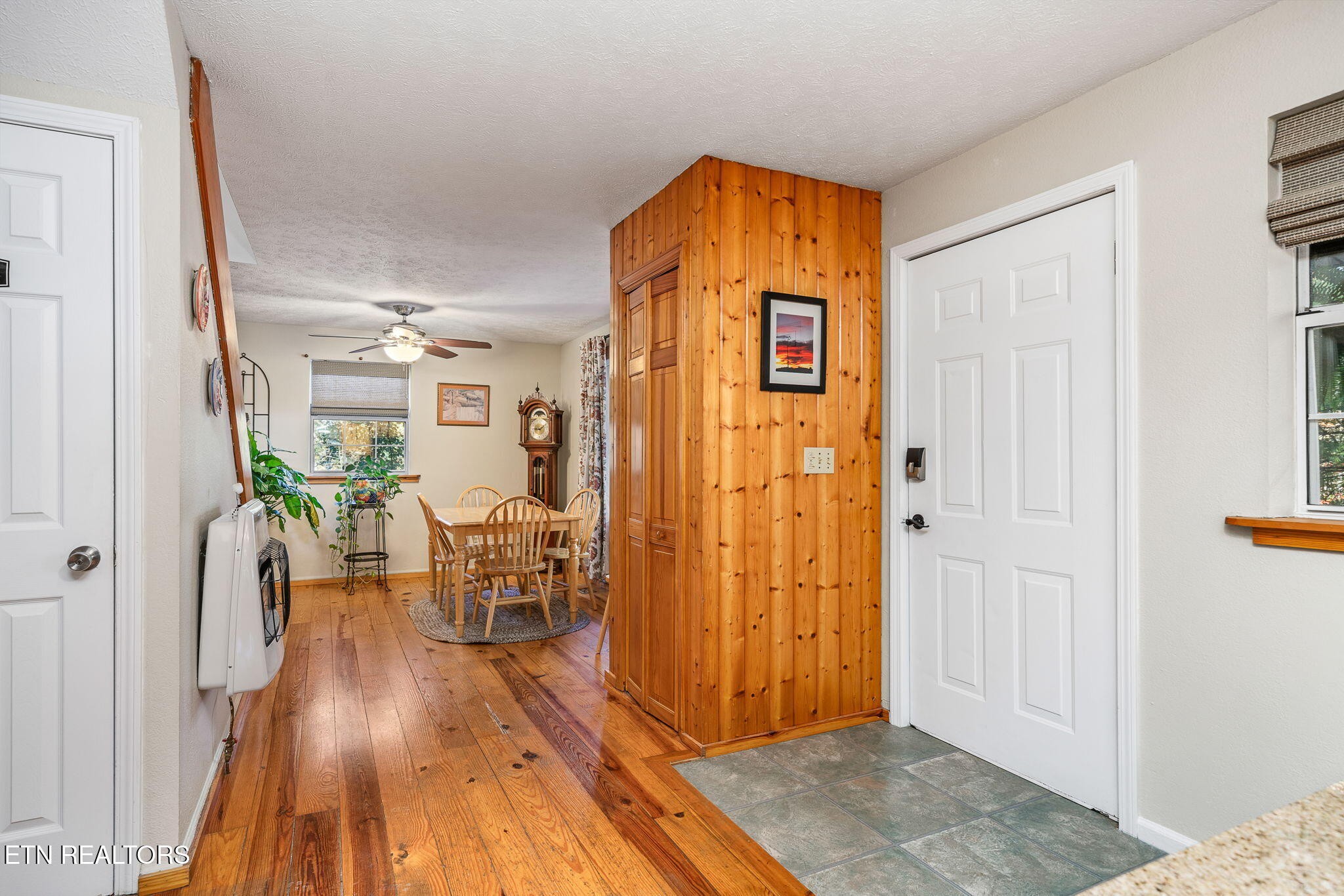279 Siever Road Crossville, TN 38572 - Photo 11 of 35 a view of a hallway with wooden floor and a living room