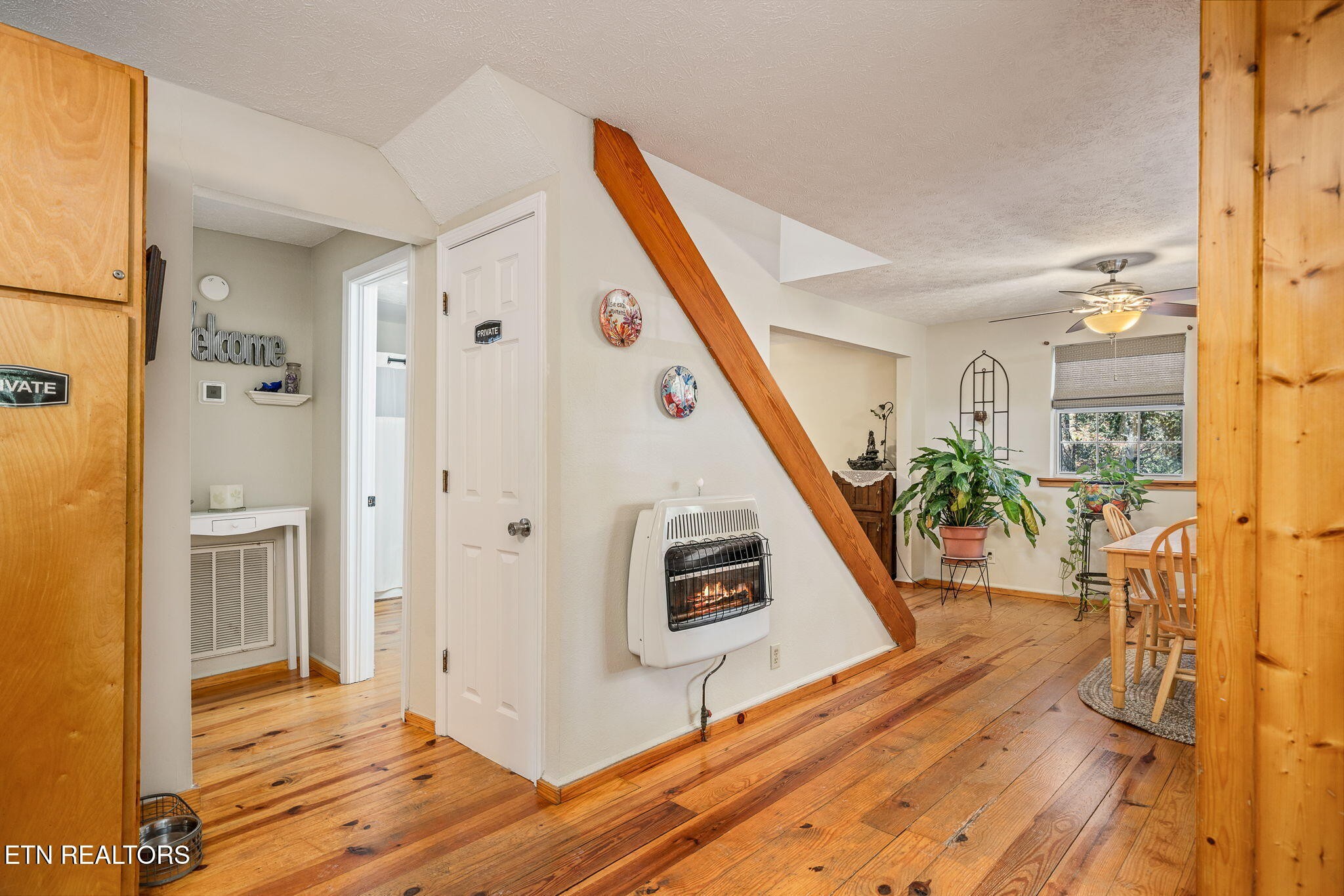 279 Siever Road Crossville, TN 38572 - Photo 12 of 35 a view of a hallway with wooden floor and staircase