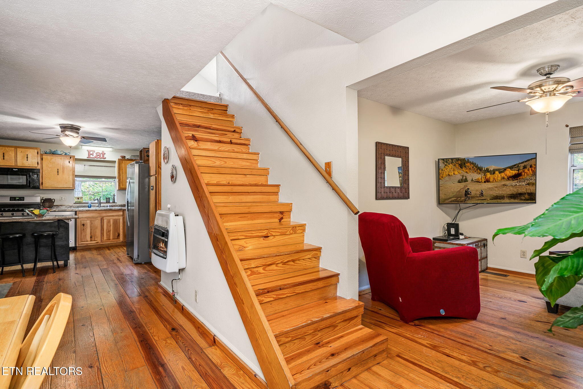 279 Siever Road Crossville, TN 38572 - Photo 13 of 35 a living room with furniture and a wooden floor