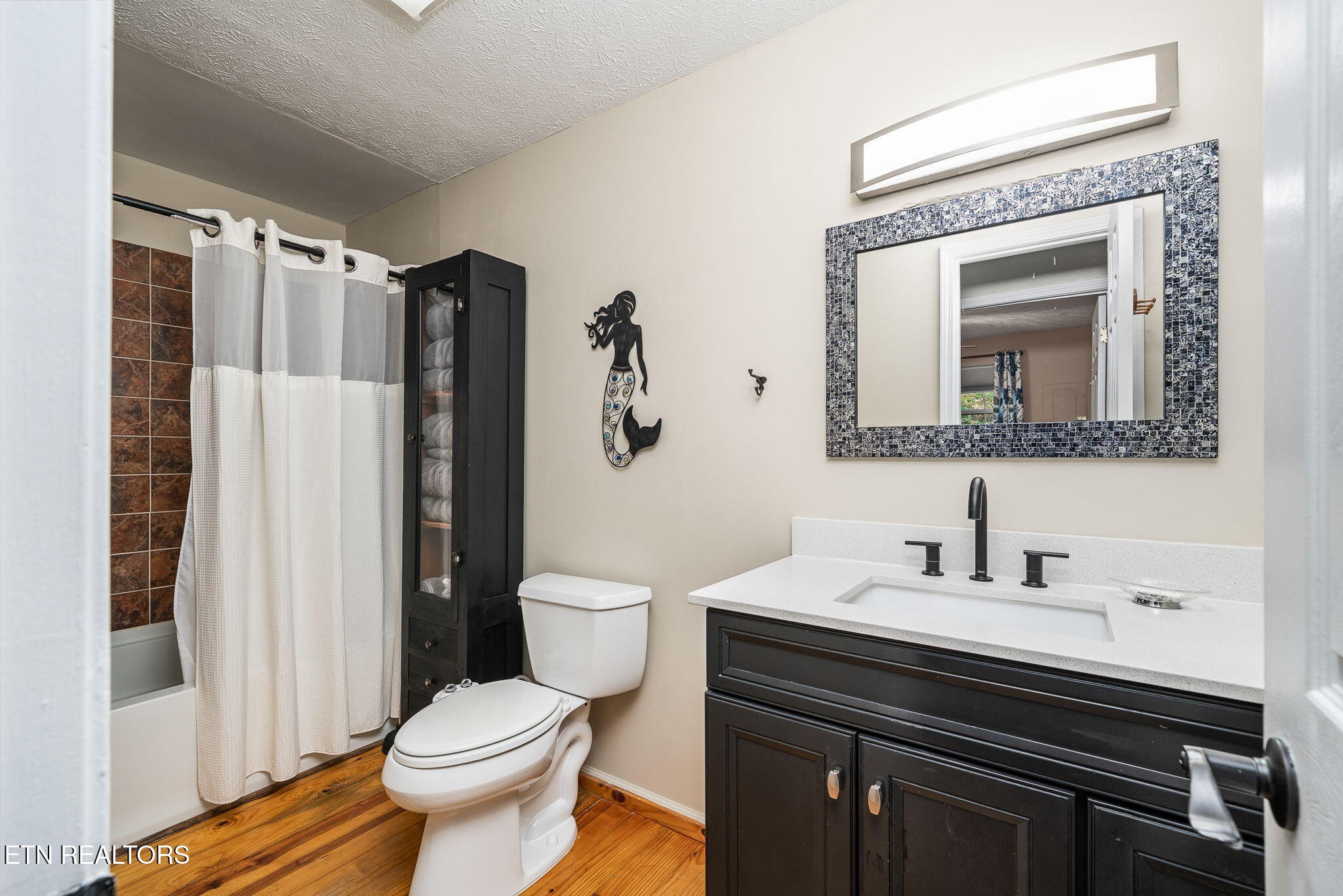 279 Siever Road Crossville, TN 38572 - Photo 16 of 35 a bathroom with a toilet sink and mirror