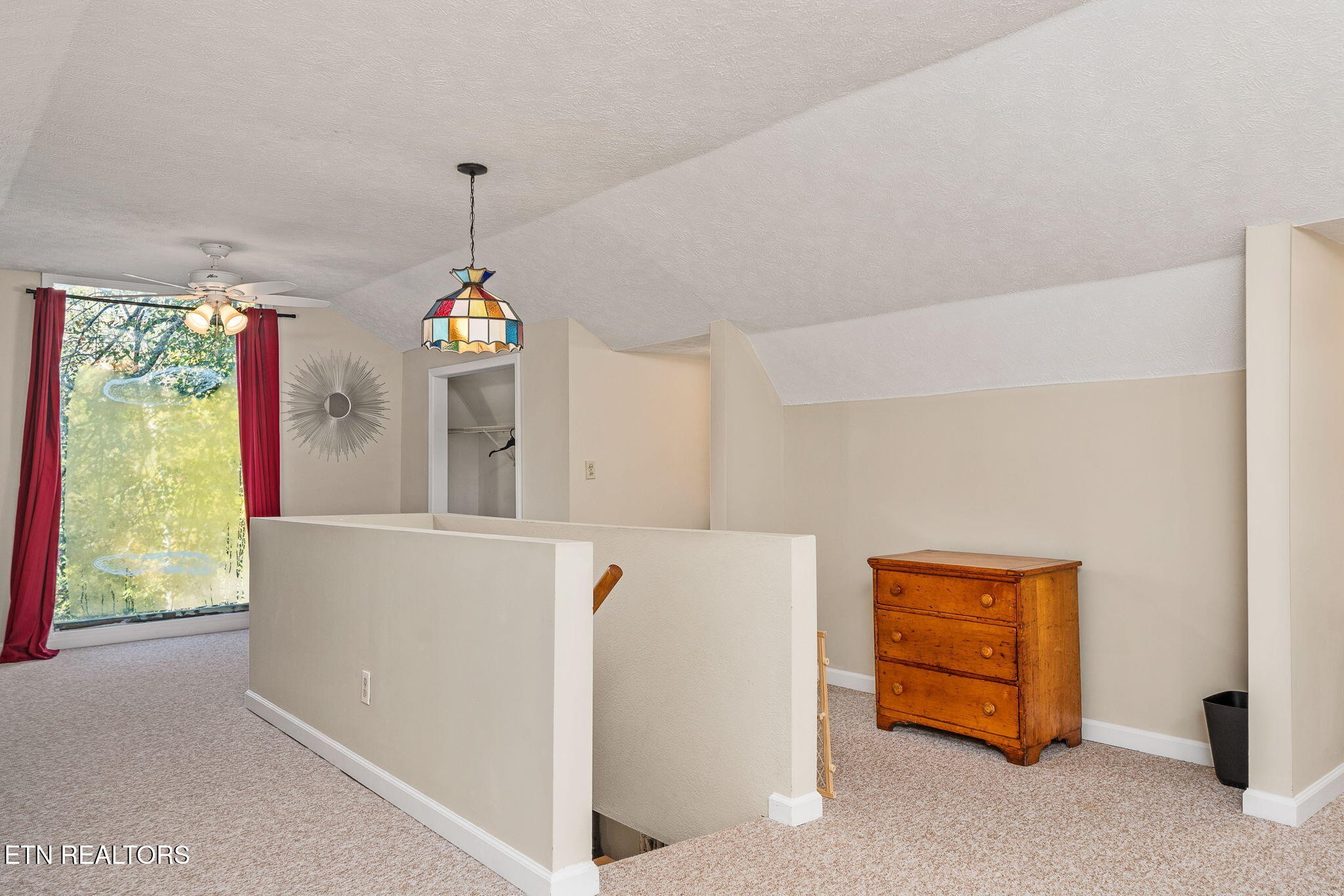 279 Siever Road Crossville, TN 38572 - Photo 17 of 35 a living room with furniture and a chandelier