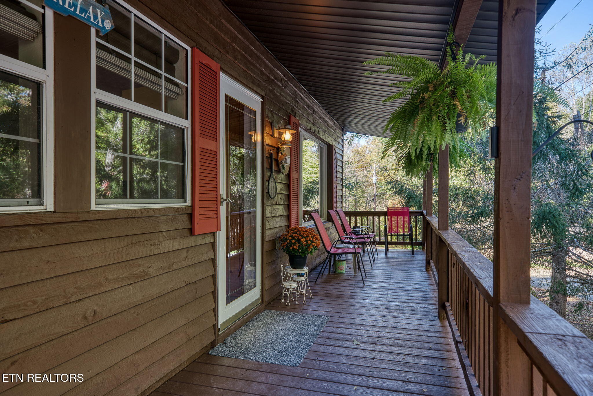 279 Siever Road Crossville, TN 38572 - Photo 4 of 35 a view of a balcony with chairs and wooden floor