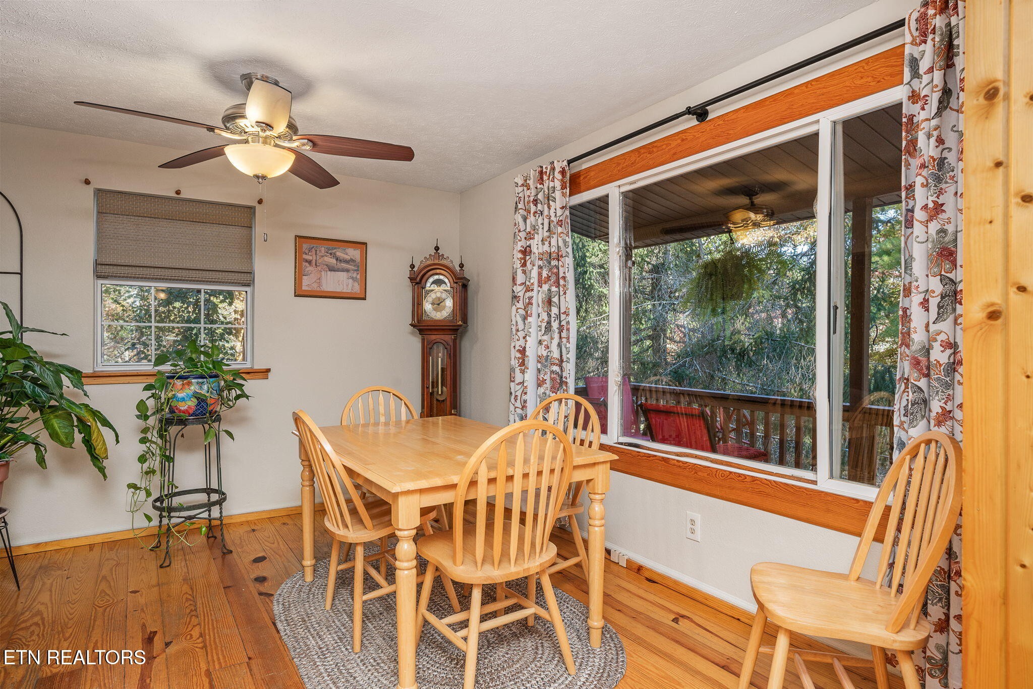 279 Siever Road Crossville, TN 38572 - Photo 7 of 35 a view of a dining room with furniture window and wooden floor