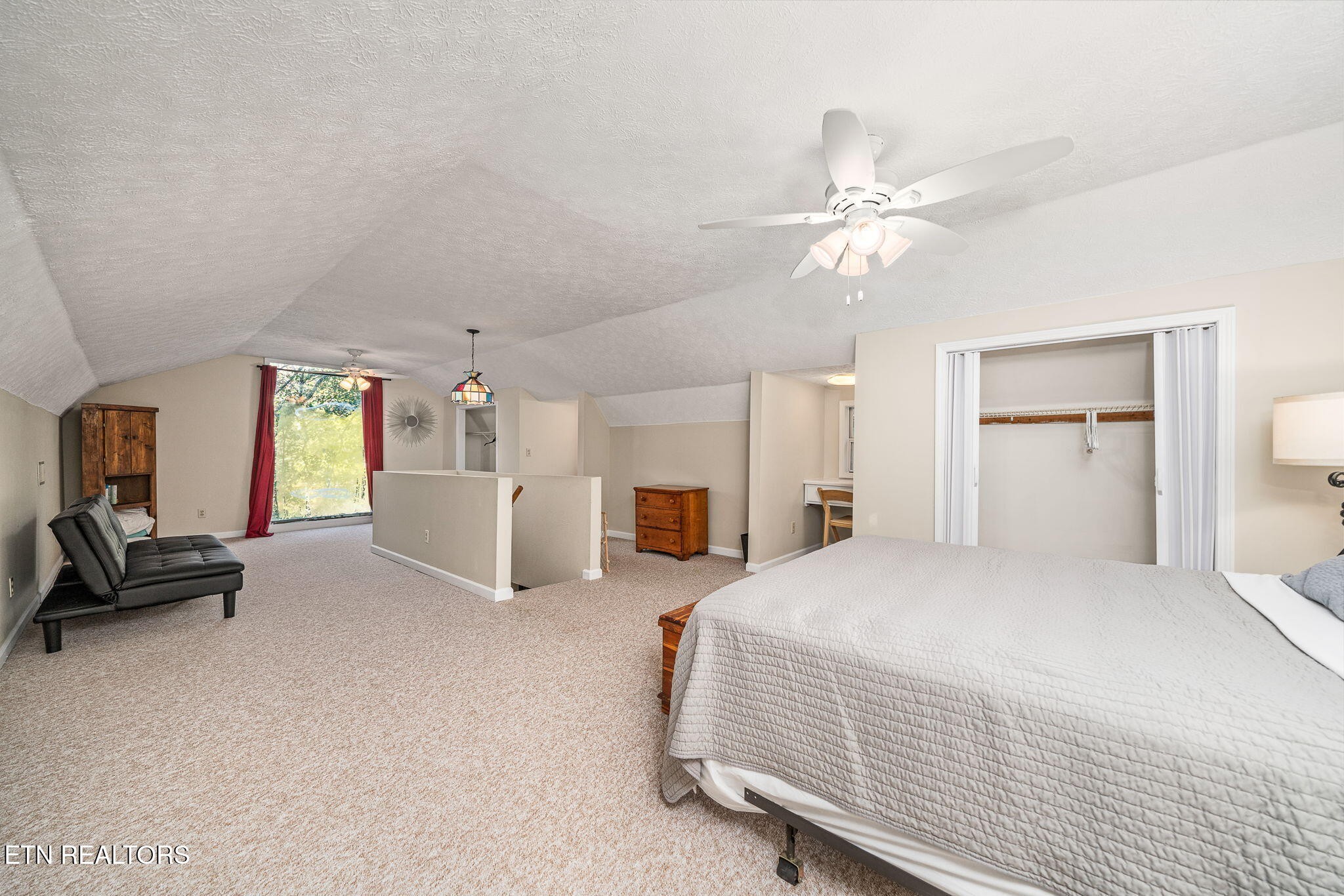 279 Siever Road Crossville, TN 38572 - Photo 8 of 35 a bedroom with furniture and a chandelier
