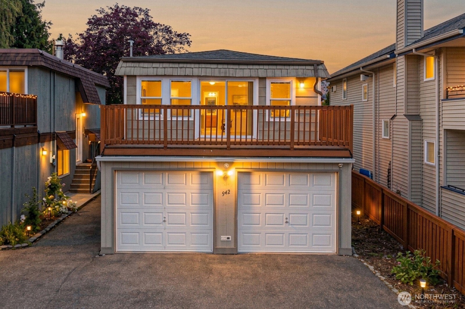 a front view of a house with a garage