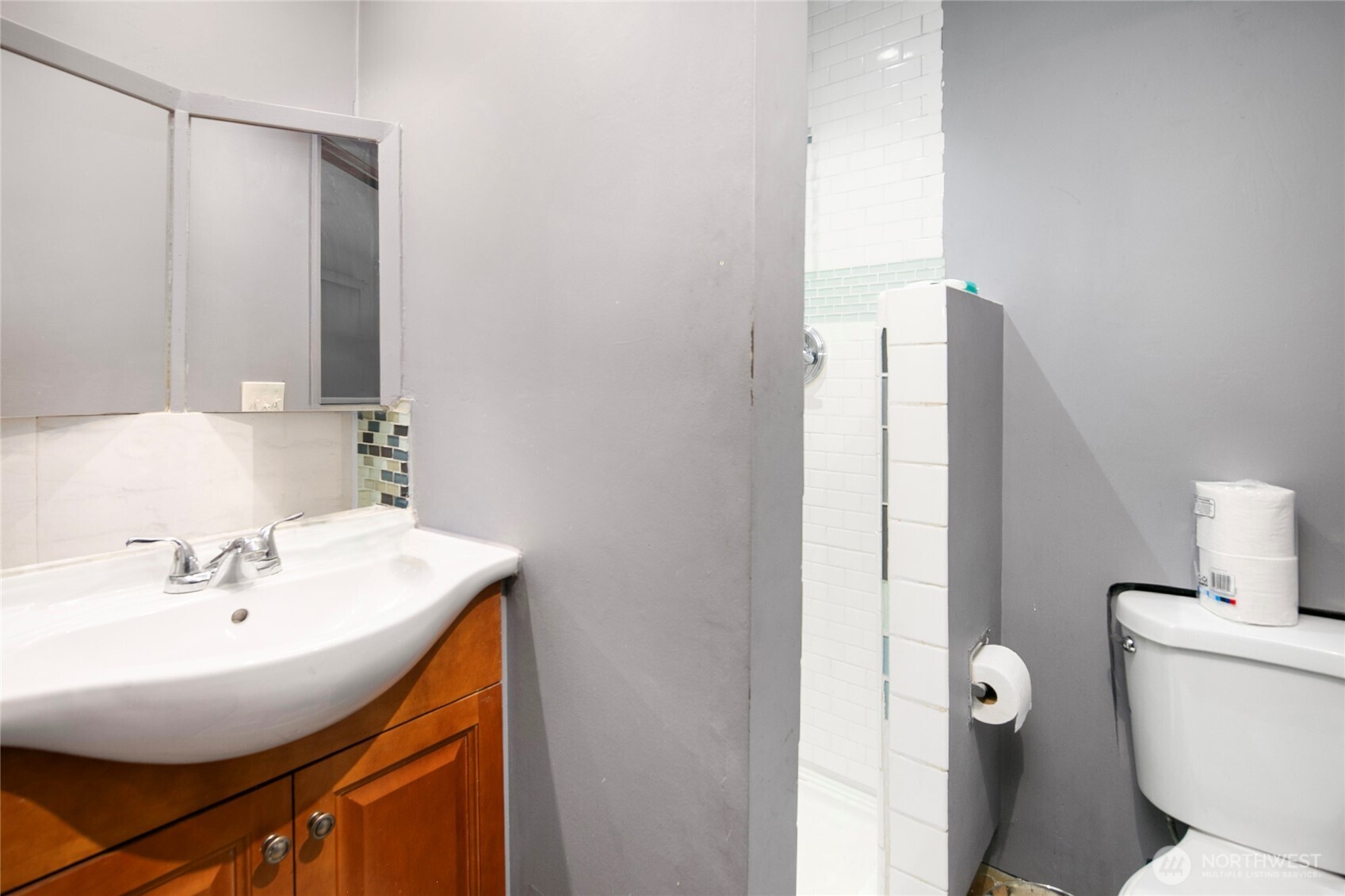 942 North 82nd Street Seattle, WA 98103 - Photo 11 of 16 a bathroom with a sink and a toilet