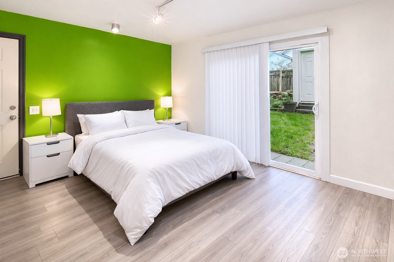 942 North 82nd Street Seattle, WA 98103 - Photo 12 of 16 a bedroom with a bed and a window