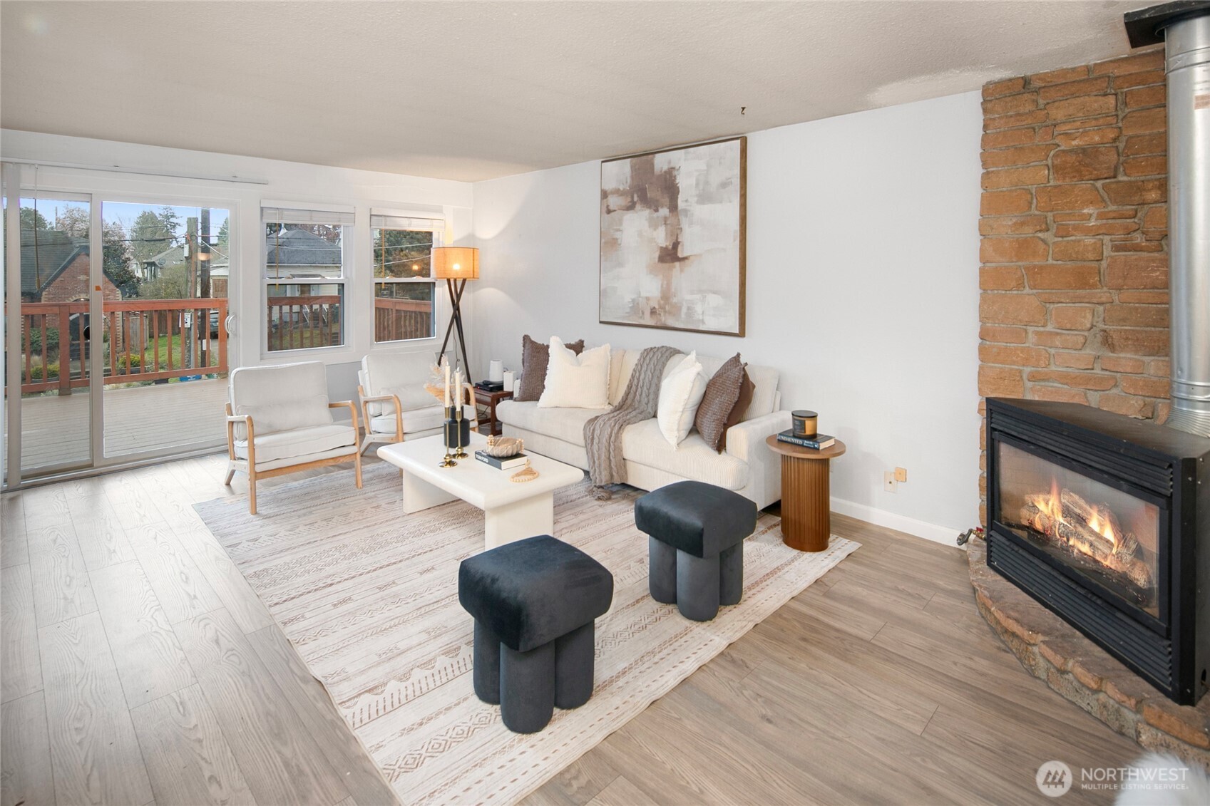 942 North 82nd Street Seattle, WA 98103 - Photo 2 of 16 a living room with furniture wooden floor and a fireplace