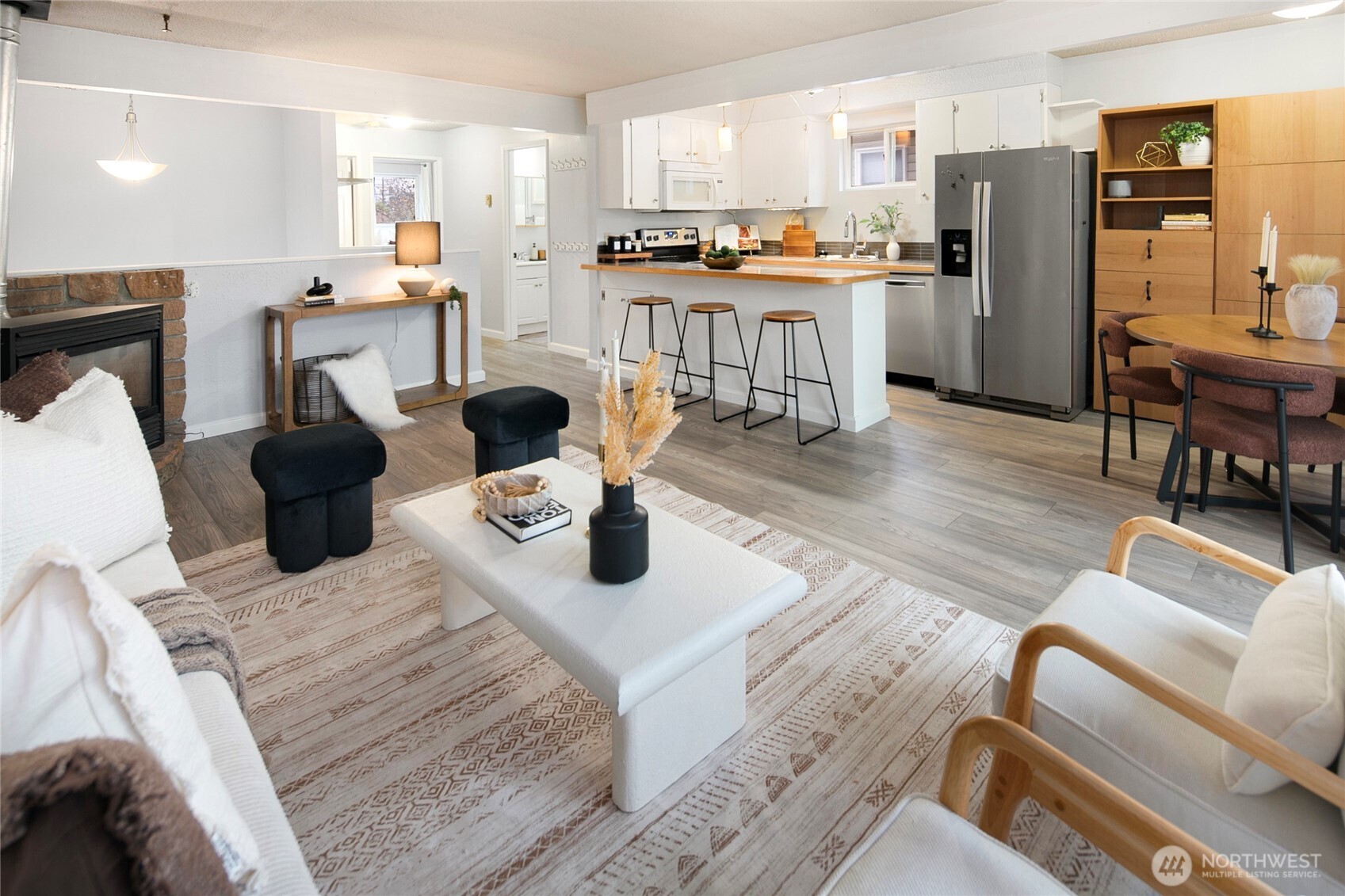 942 North 82nd Street Seattle, WA 98103 - Photo 3 of 16 a living room with stainless steel appliances furniture and a kitchen view