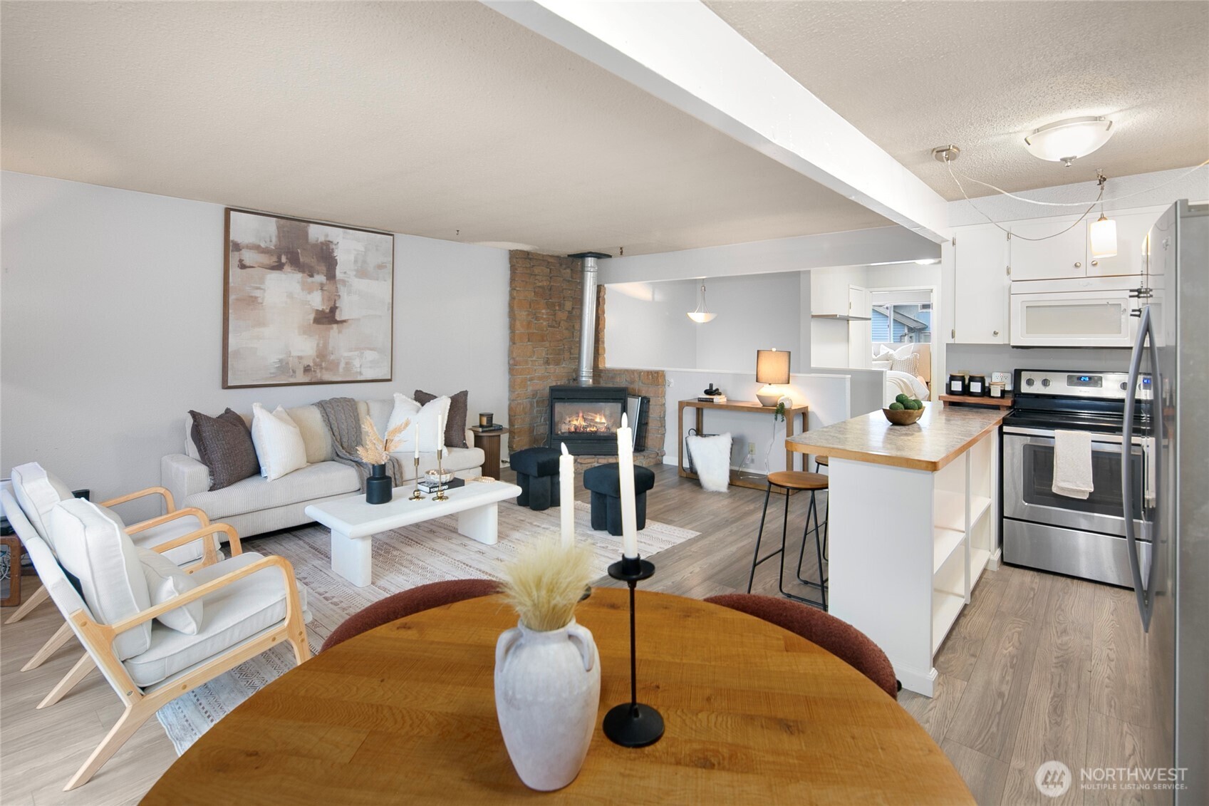 942 North 82nd Street Seattle, WA 98103 - Photo 6 of 16 a living room with stainless steel appliances furniture and a kitchen view