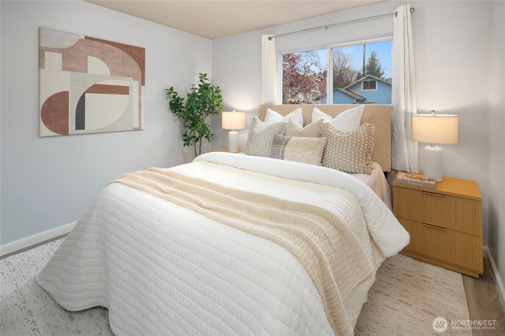 942 North 82nd Street Seattle, WA 98103 - Photo 8 of 16 a large white bed in a white room