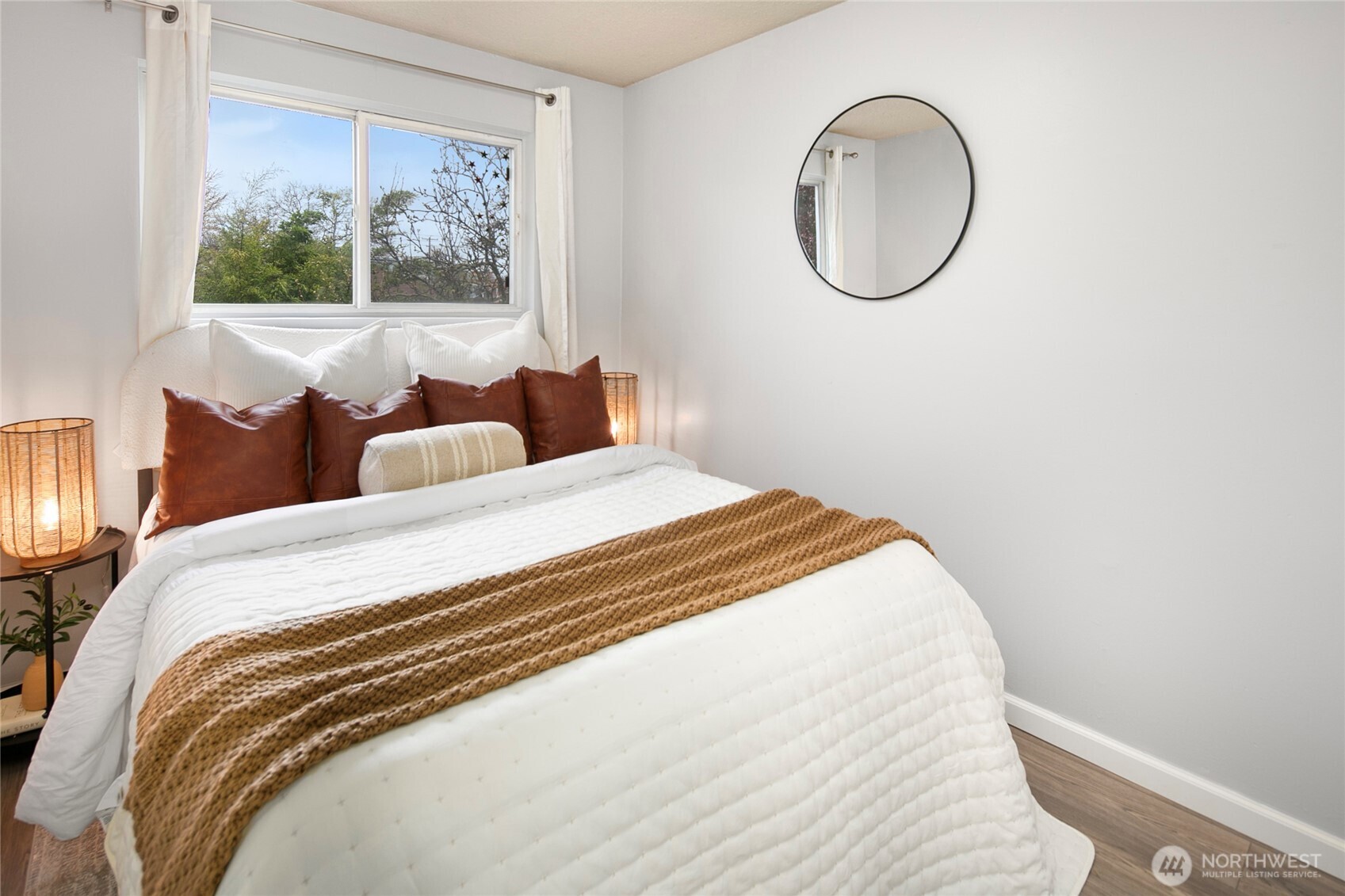 942 North 82nd Street Seattle, WA 98103 - Photo 9 of 16 a bedroom with a bed and a painting on the wall